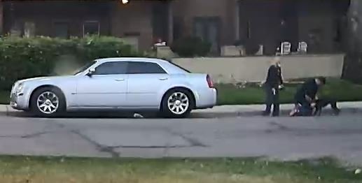 A man holds a dog in place, while a woman holds a handgun and prepares to shoot the animal, Aug. 1, near the intersection of 12th Avenue and Teller Street in Lakewood Colorado.
The man and woman then drove off in the silver Chrysler 300, leaving the dead dog in the vicinity.